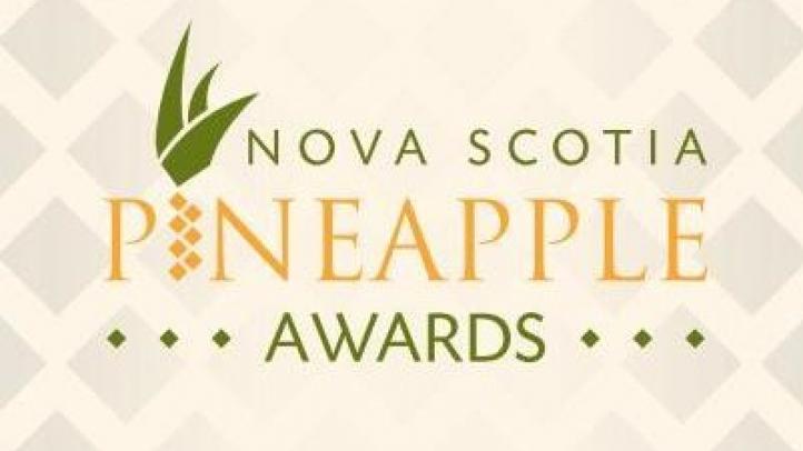 The word Nova Scotia in green text, the word pineapple in yellow text, and the word awards in green text all in front of a tan background